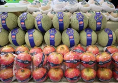 Fresh melons and apples under the brand of XianFeng Fruits.
